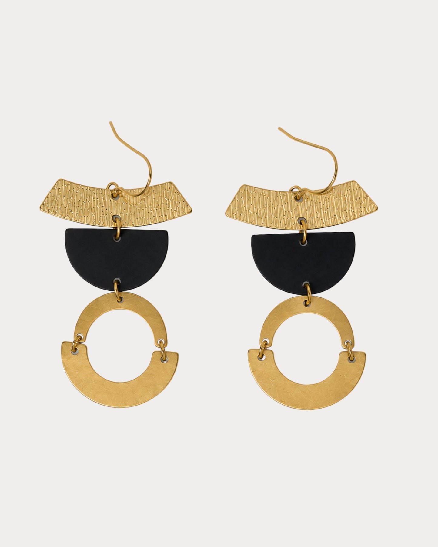 Close-up detail of The Alea gold bar and black semi-circle statement earrings — Olivia Holland