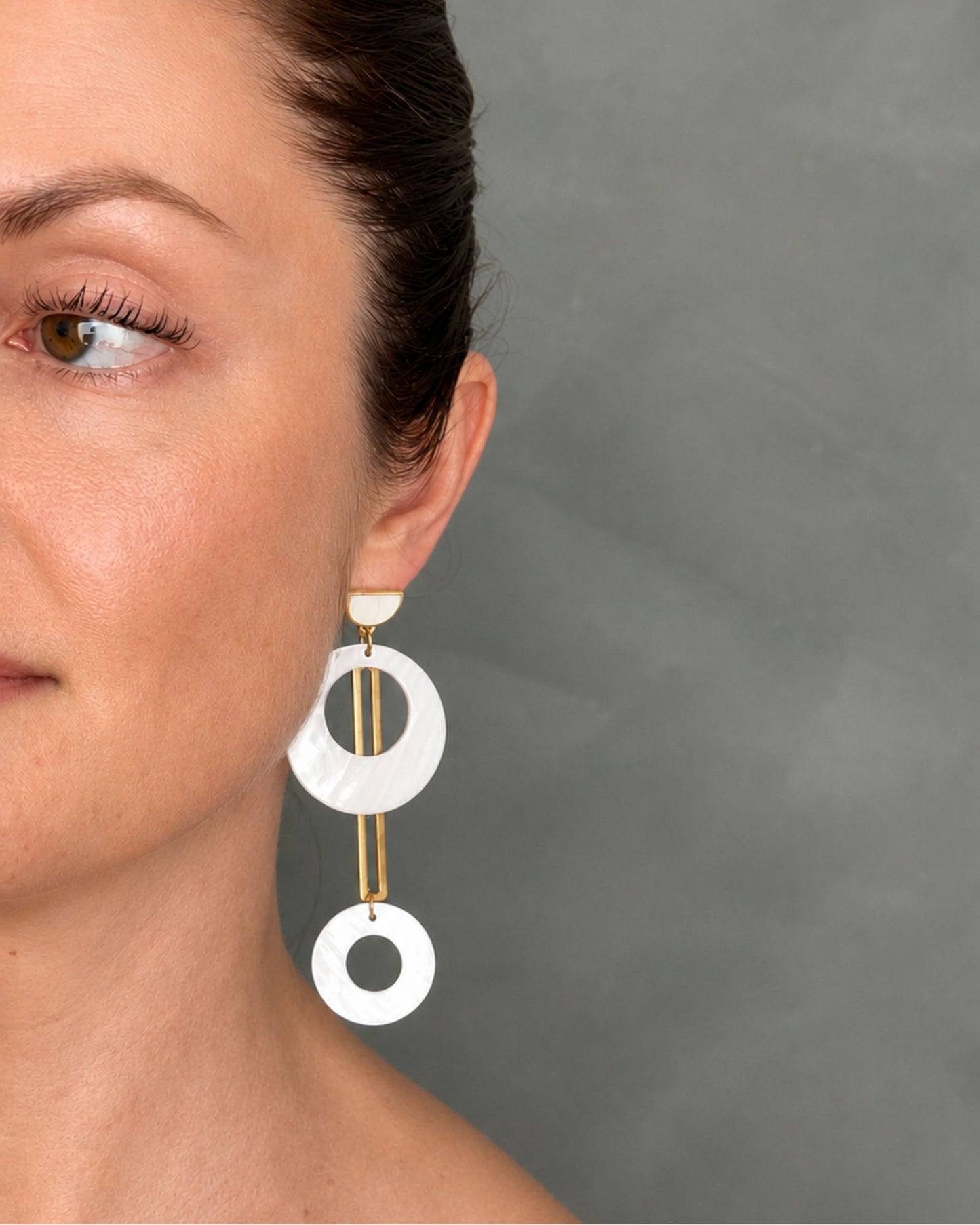 The Jesa gold and natural seashell statement earrings worn, second view — Olivia Holland