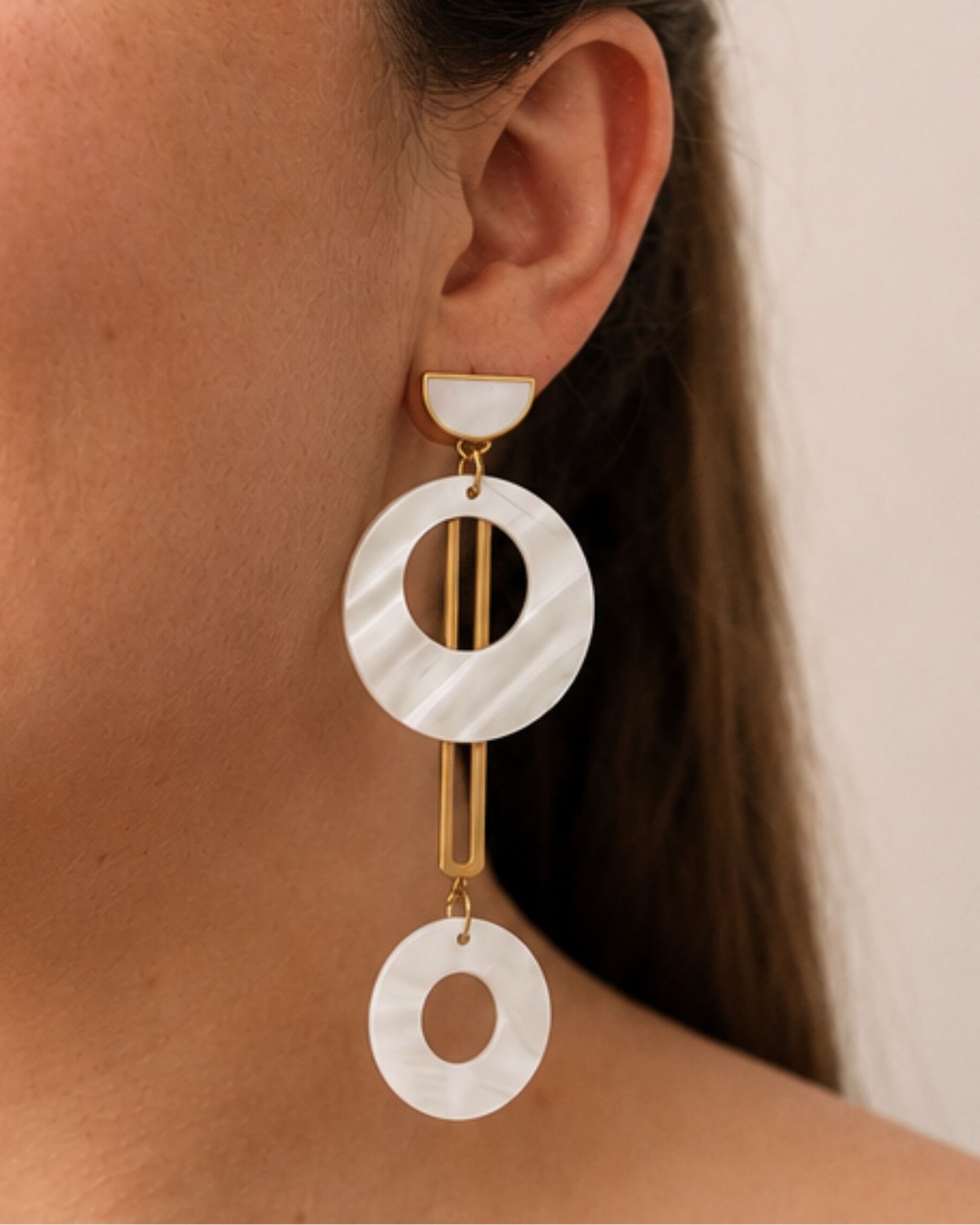 The Jesa gold and natural seashell statement earrings shown on model — Olivia Holland