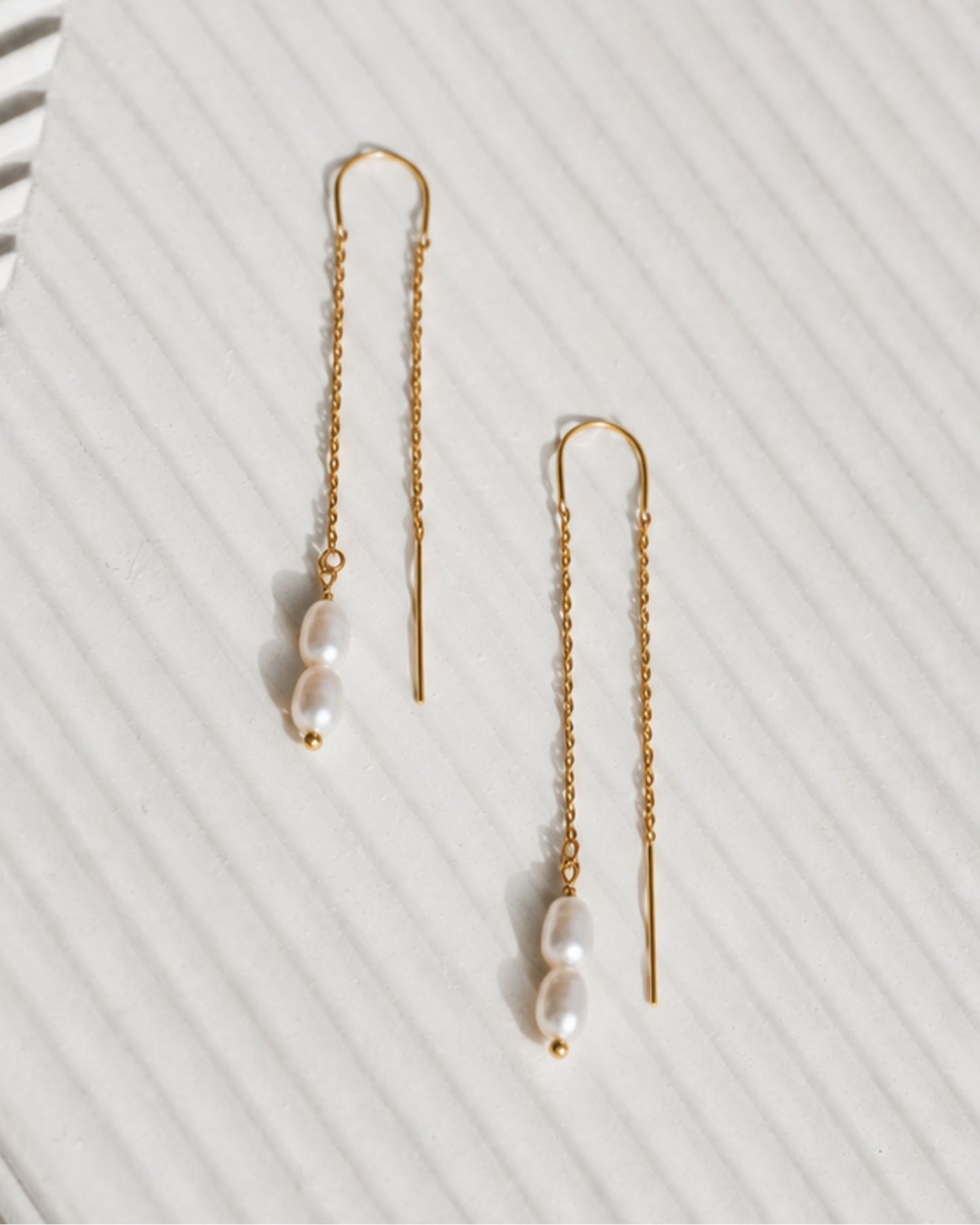 Close-up detail of The Wren delicate gold chain and freshwater pearl earrings — Olivia Holland